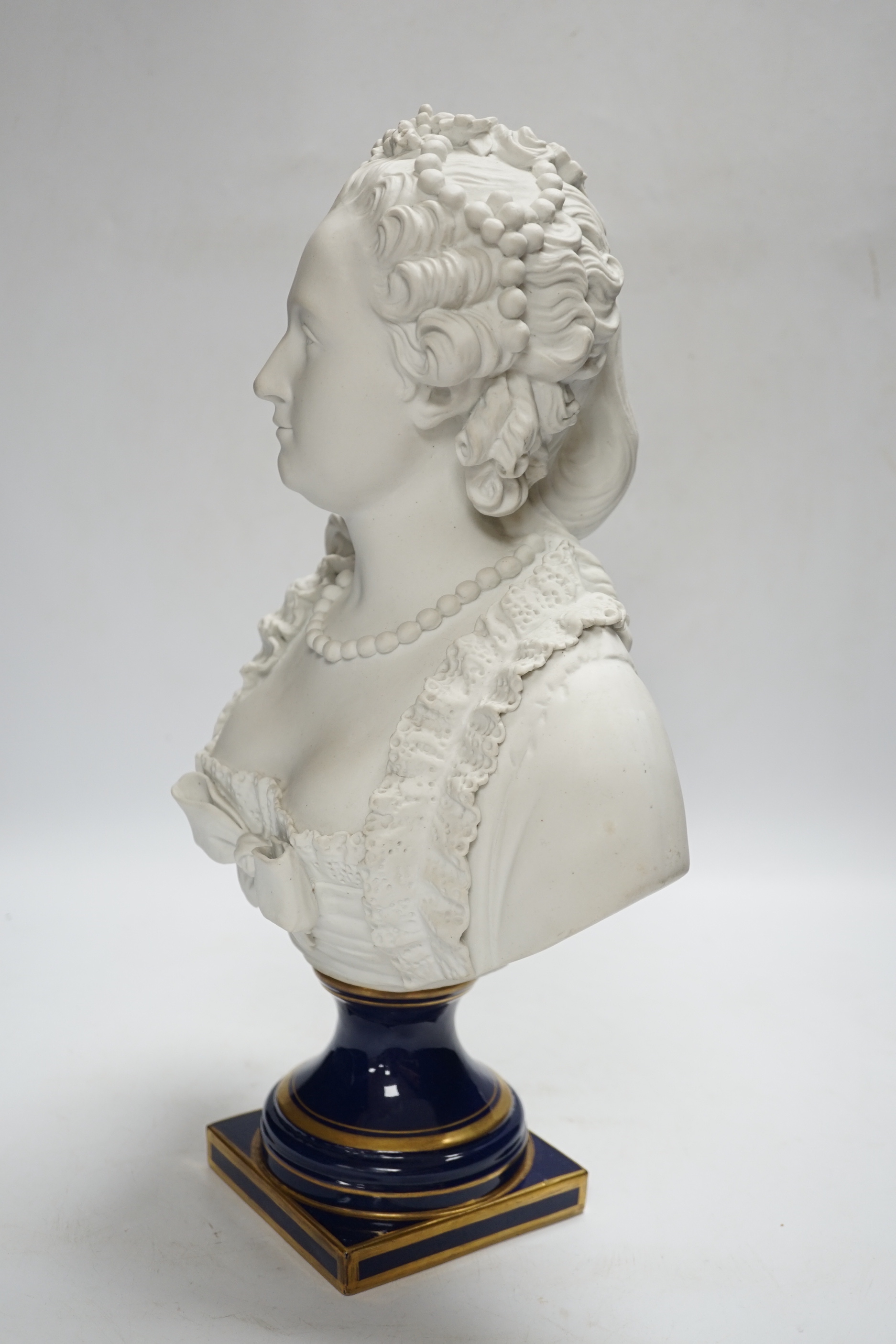 A Sevres style biscuit porcelain bust of a courtesan, 42cm high